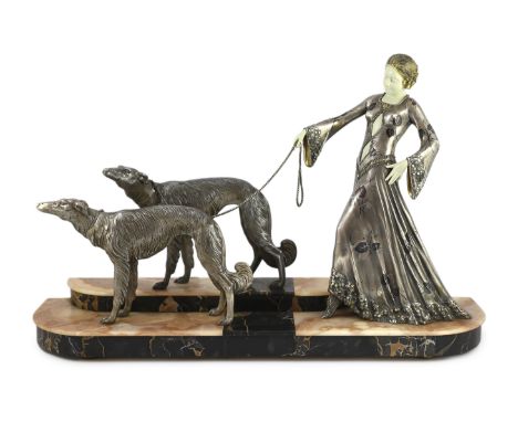 Georges Gori (French, 1894-1944). An Art Deco silvered bronze, spelter and composition group of an elegant lady and two borzo