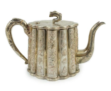 A late 19th/early 20th century Chinese Export silver teapot, by Luen Wo, Shanghai, of lobed oval form with bamboo finial (lac