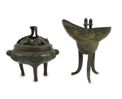 A Chinese bronze and copper alloy tripod censer and cover and a Chinese archaistic bronze tripod vessel, yi, both 17th centur