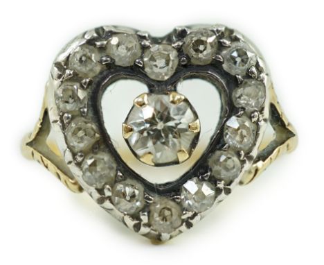 An antique gold and diamond set heart shaped open work cluster ring, size K, gross weight 4 grams.***CONDITION REPORT***Some 