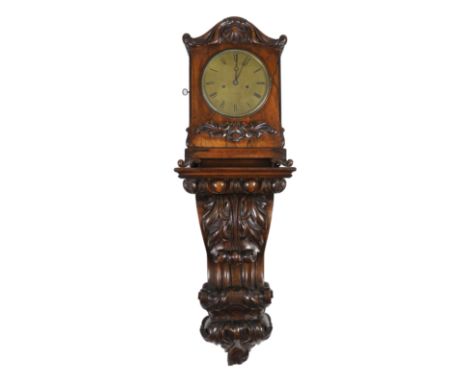 An unusual William IV rosewood wall clock, shaped to look like a bracket clock upon a wall bracket but constructed as a singl