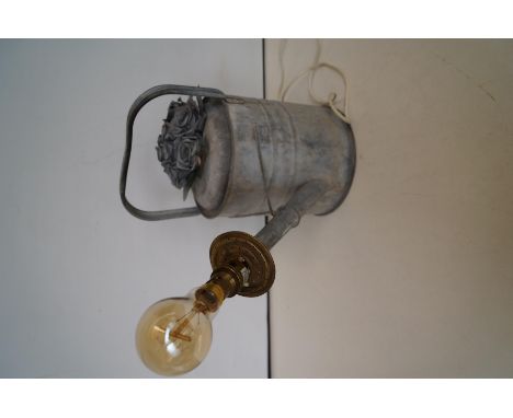 Galvanised watering can made into a lamp