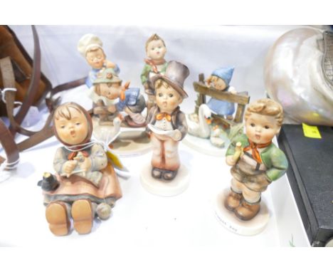 Seven Hummel figurines including Trumpet Boy, Barn Yard Hero and Feathered Friends 