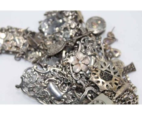 GOOD COLLECTION OF VINTAGE MAINLY SILVER JEWELLERY
including a silver charm bracelet, silver brooches, silver Celtic cross, g
