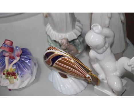GROUP OF CERAMIC FIGURES
including a Royal Crown Derby 'Tropical Fish Sweetlips' figure, two Lladro figures of girls with ani