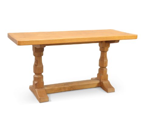 ROBERT THOMPSON OF KILBURN, A MOUSEMAN OAK COFFEE TABLE, circa 1970s, the adzed rectangular top raised on a trestle base with