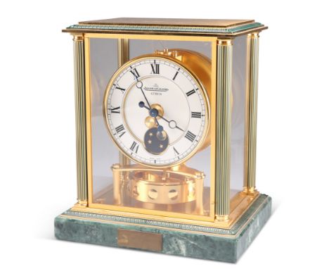 A JAEGER-LECOULTRE ATMOS CLOCK, the case with fluted columns and glazed sides, the white enamel dial with Roman numerals and 