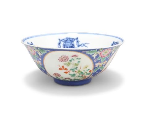 A DAOGUANG STYLE FAMILLE ROSE BOWL, flared circular form, the interior blue painted with objects, the exterior with four circ