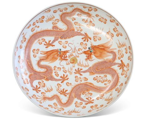 A CHINESE IRON-RED 'TWO-DRAGON' CHARGER, bears Guangxu six character mark, the interior enamelled with two five-clawed dragon