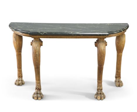 A CARVED AND GILDED MARBLE-TOPPED CONSOLE TABLE, PROBABLY IRISH, the painted break-front marble top with D-shaped ends, raise