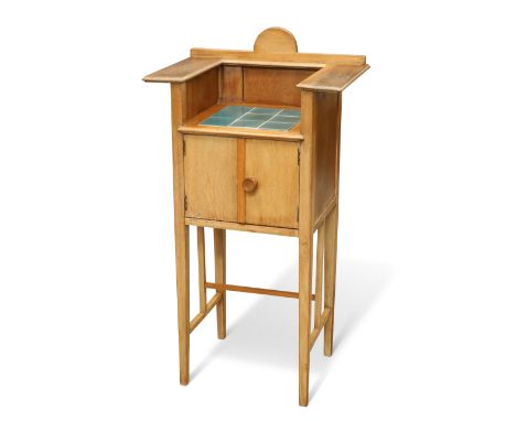 AN ARTS AND CRAFTS BEECH WASHSTAND, with blue-glazed nine tile panel to the top, fitted with a pair of cupboard doors and rai