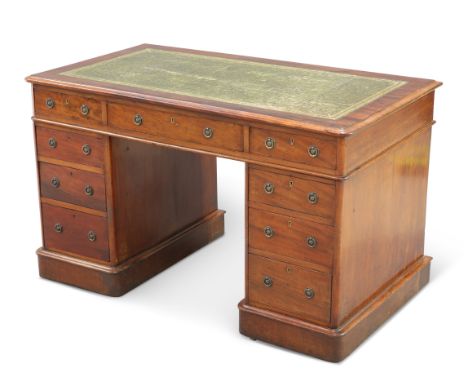 A VICTORIAN MAHOGANY PEDESTAL DESK, the moulded rectangular top with rounded corners and gilt-tooled leather-inset writing su