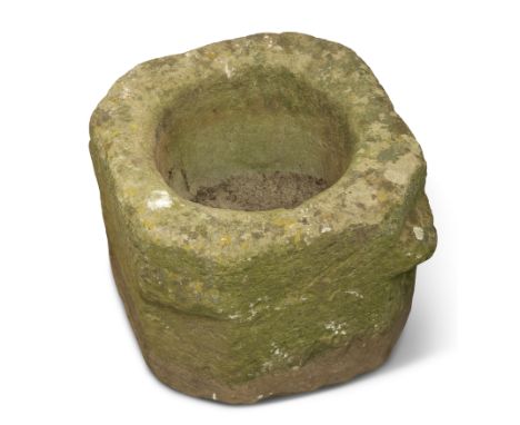 AN OLD WEATHERED STONE PLANTER, square section with canted corners, circular recess. 31.5cm high by 37cm wide