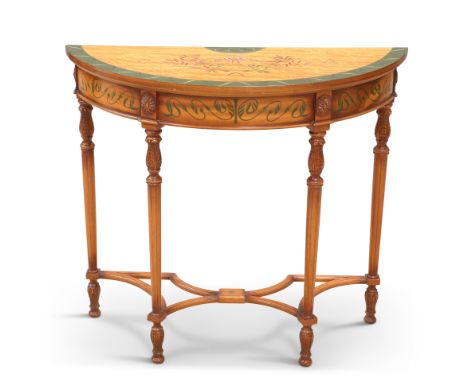 A NEOCLASSICAL STYLE DEMILUNE CONSOLE TABLE, decorated with ribbon-tied swags and scrolling sinuous foliage, raised on fluted