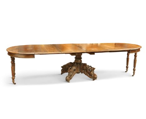 A CONTINENTAL 19TH&nbsp;CENTURY OAK EXTENDING DINING TABLE, the ends of circular form, raised on a central column, the suppor