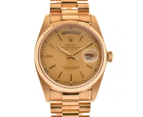 Rolex - Gentleman's 18K Day Date automatic chronometer bracelet watch, ref.18038, having a signed gilt dial with baton hour m