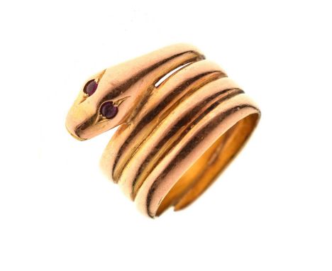 Early 20th century 15ct gold ring modelled as a coiled snake with two small round cabochon cut ruby eyes, hallmarked Birmingh