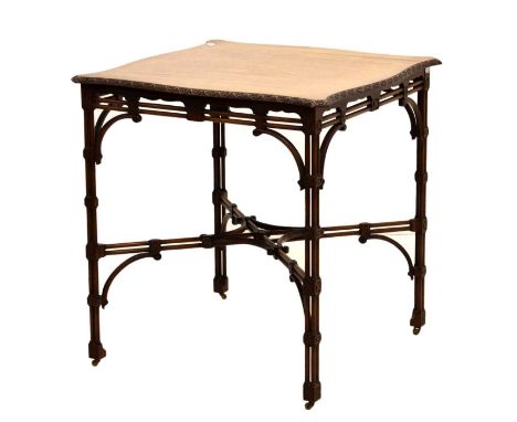 Chippendale Revival mahogany occasional table with cluster columns, circa 1900, the serpentine top with flowerhead lunette-ca