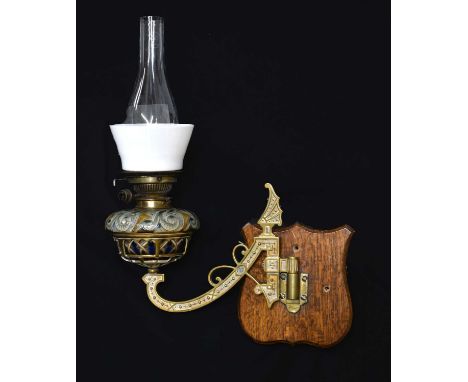 Late Victorian Doulton Lambeth stoneware wall lamp, with glass chimney and shade over foliate scroll incised stoneware reserv