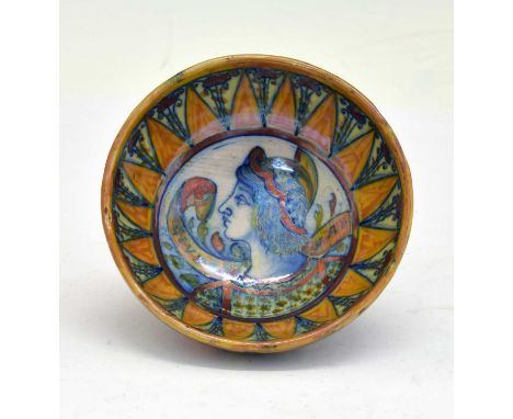 Small Italian maiolica lustre bowl, circa 1900, of hemispherical form internally decorated with a profile bust portrait of St