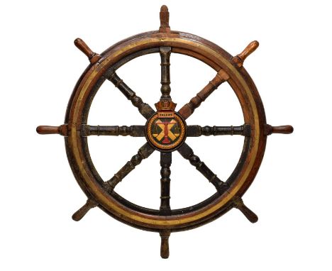 Early 20th century ship's oak wheel, of eight knopped turned gun-barrel spokes (seven of these ebonised) around an applied ce