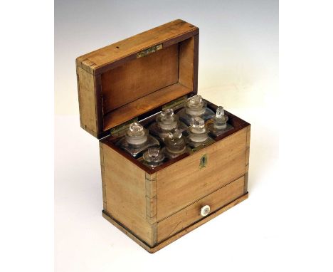 Apothecary's 19th century mahogany box, circa 1850, the hinged cover enclosing seven various bottles (three labelled) over ba