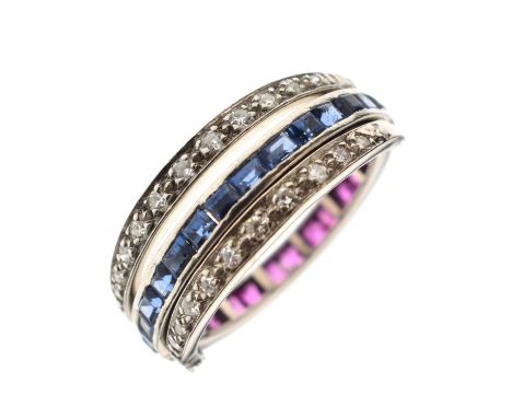 Art Deco Day and Night ruby, sapphire and diamond ring, calibré cut rubies and sapphires, channel set, with a swivel half ban