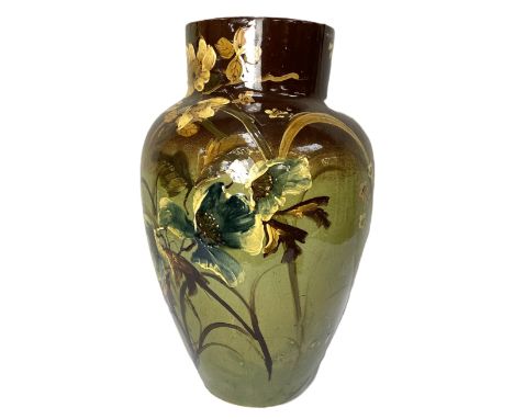 A very large slipware vase, in manner of Burmantofts, early 20th century,  the oviform body decorated with flowers on a green