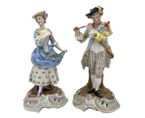 A pair of Dresden porcelain figures of a Lady and Gallant, 19th century,   she holding her dress enclosing roses; he playing 