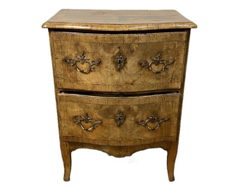 A Dutch serpentine walnut veneered commode, late 18th or early 19th century,   with a quarter veneered and cross-banded top o