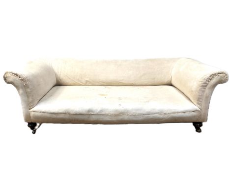 A Victorian sofa with scrolled arms on turned supports and Archibald Kenrick & Sons castors,  76 x 225 x 110 cm  The Alastair