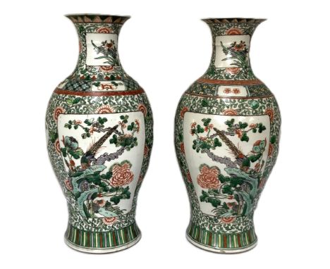 A large pair of Chinese famille verte porcelain vases, Qing Dynasty, 19th century,   each of typical baluster form, decorated