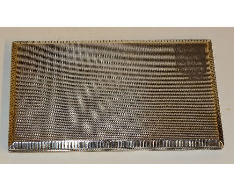 A silver cigarette case, hallmarks for Birmingham 1953 AW, of rectangular formation with engine turned decoration and gadroon