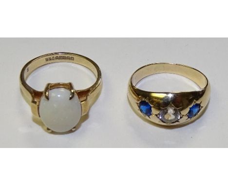 A 9ct gold opal ring, set with central white cabochon opal in claw setting, opal measures 12 x 10mm, stamped 375 to underside