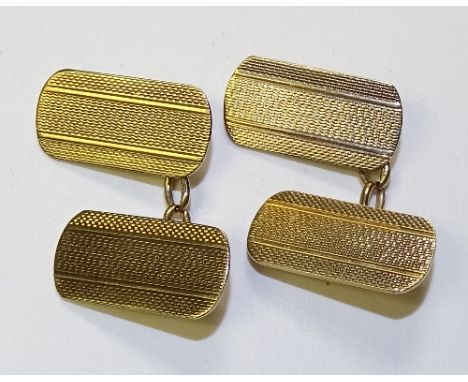 A pair of 9ct gold cufflinks, with engine turned decoration to front, stamped 375 to reverse, 5.3g