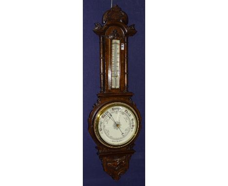 An oak aneroid barometer, with thermometer gauge, 90cm high