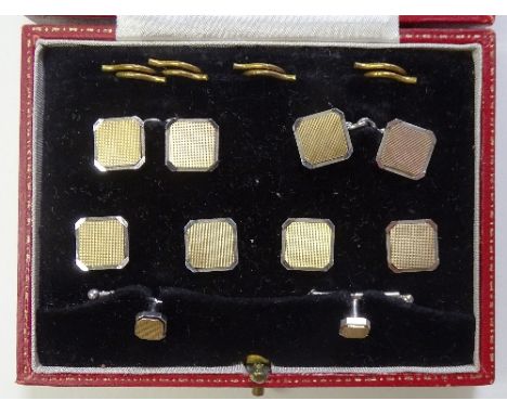 A 9ct white & yellow gold cufflink and stud set, in fitted box by Hamilton & Inches, of plain, square, engine turned design, 