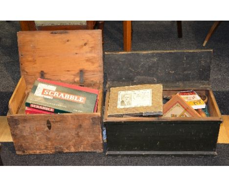 Two boxes of vintage children's games, in two small Victorian pine collectors boxes (a lot)
