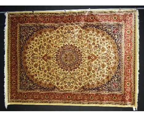 A machine made Keshan carpet on beige ground, 280 x 200cm