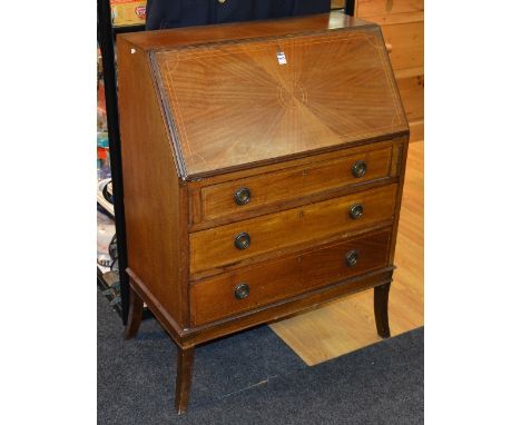 A vintage mahogany inlaid and pine lined writing bureau, with hinged fall front, enclosing drawer and pigeon holes, above thr