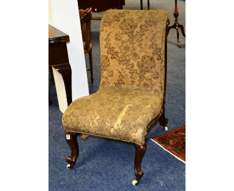 A Victorian rosewood gossip chair, with original upholstery and ceramic castors, 88cm high