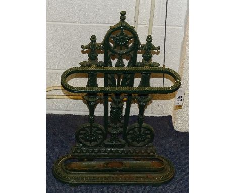 A Victorian cast iron painted stick stand, painted in green, with drip tray, 69cm high