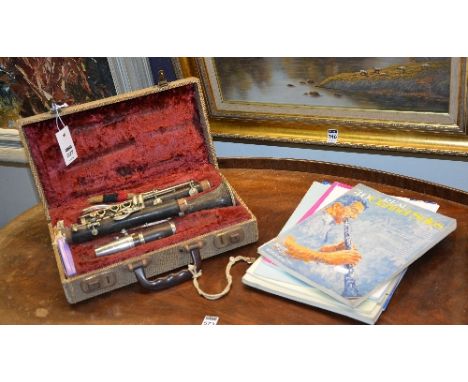 A clarinet by Selmer of London, named 'Sterling', in fitted case, also with some music books (a lot)