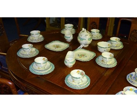 A Royal Doulton Kingswood tea service, to include teapot, decorated with flowers and turquoise panels on white ground (45)