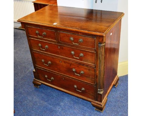 A George III style mahogany chest of drawers, of small form, with to small drawers above three long drawers, raised on bracke