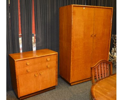 A vintage oak and walnut three piece bedroom suite in the Art Deco style, comprising of two door wardrobe, 184cm high x 122cm
