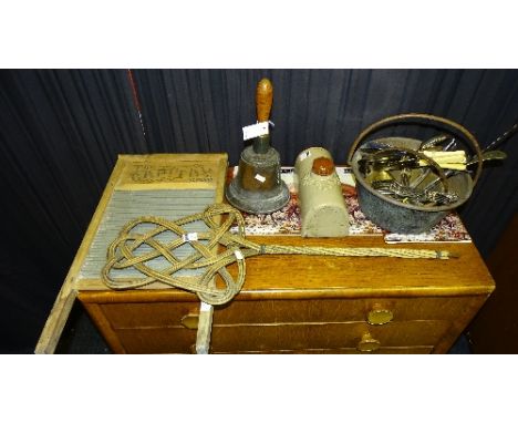 A small quantity of plated cutlery, together with a Capital vintage washboard, a large vintage bell, a cane work carpet beate