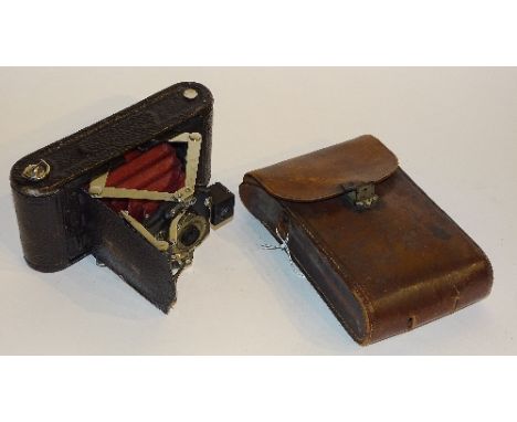 A vintage early 20th century folding camera, by Eastman Kodak Co, Rochester NY, with pocket automatic lens and concertina act