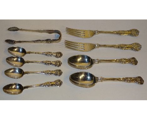 A part silver cutlery set, comprising of six dessert spoons, six dinner forks, five side forks, 19 teaspoons and sugar tongs,