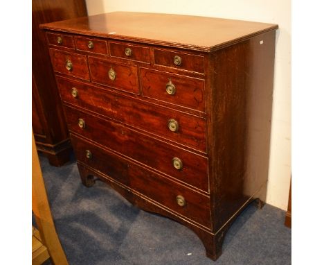 A Georgian mahogany chest of drawers, with four small drawers, above three graduated drawers, raised on bracket supports, 110